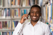 © Jale Ibrak - Male Student Talking On The Phone In Library