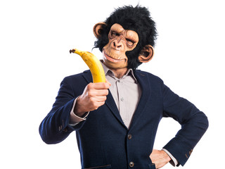 Wall Mural - Monkey man holding a banana