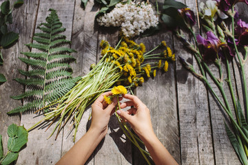 flower decoration of dandelions and flowers handmade on wood tab