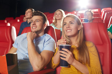 Wall Mural - happy friends watching movie in theater