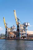 Fototapeta Miasto - Two container cranes in Gdansk harbor