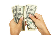 A Men Hand Holding Hundred Dollars Bill On White Background