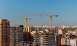 © svetlana - Cranes on the building construction site.