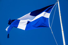 National Flag Of Greece Against Blue Sky Background