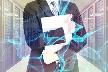 Poster - Composite image of businessman holding his laptop tightly