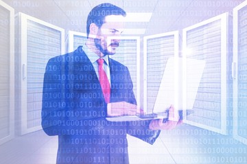 Poster - Composite image of focused businessman using his laptop
