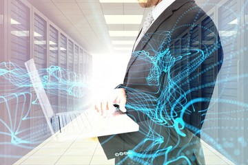 Fototapete - Composite image of businessman holding laptop