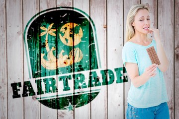 Poster - Composite image of pretty blonde feeling guilty to eat 