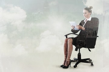 Poster - Composite image of businesswoman sitting on swivel chair with ta