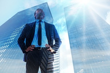 Poster - Composite image of happy businessman with hands on hips