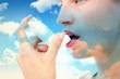 © WavebreakmediaMicro - Composite image of blonde woman taking her inhaler