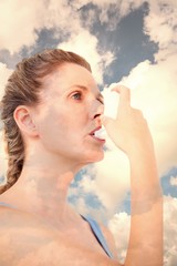 Poster - Composite image of woman using inhaler for asthma