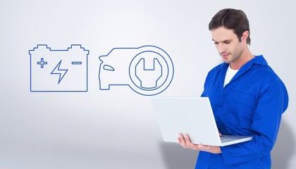 Poster - Composite image of mechanic using laptop over white background