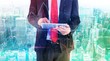© WavebreakMediaMicro - Composite image of businessman scrolling on his digital tablet
