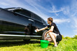 © kolotype - Man Washing Car in Field on Sunny Day