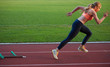 © .shock - woman  sprinter leaving starting blocks