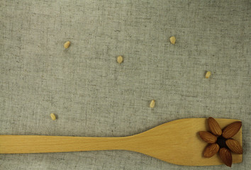 aabstract view of a wooden shovel with almonds