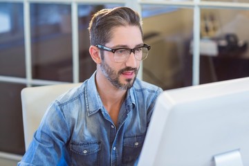 Sticker - Casual businessman looking at computer screen