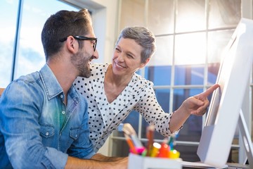 Sticker - Casual businesswoman showing the screen to her partner