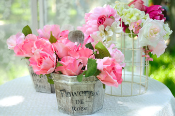 Decorative artificial roses flowers in vase