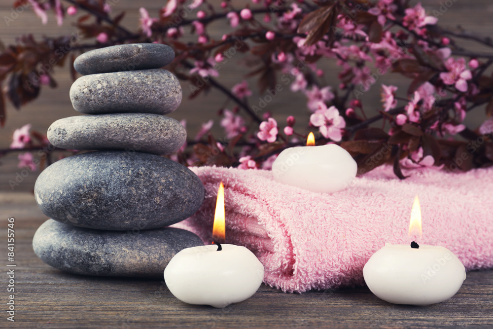Spa still life with flowering branches on wooden background