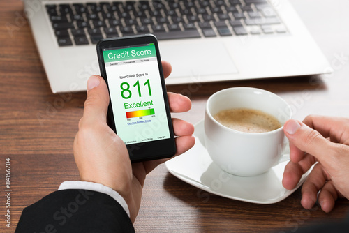 Fotografía Businessman Checking Credit Score On Cellphone
