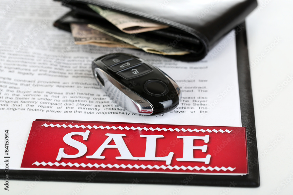 Tablet, purse and automatic key for car isolated on white