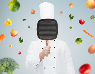 Sticker - male chef cook covering face with grill pan