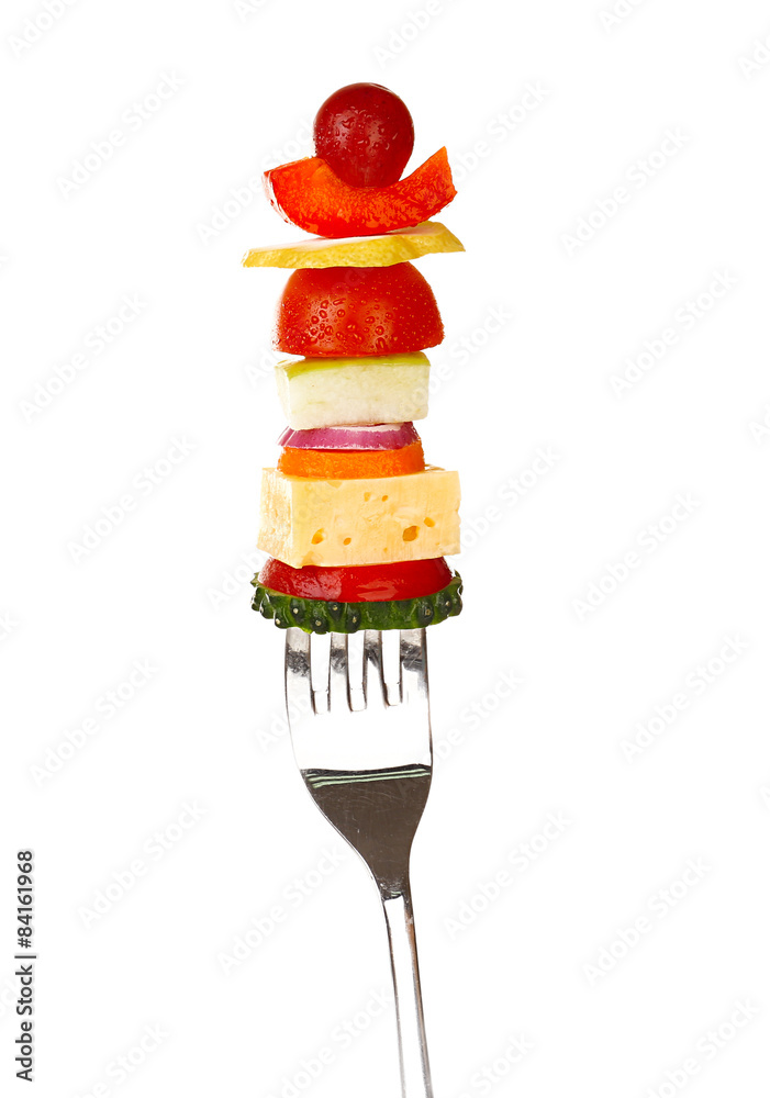 Snack of vegetables on fork isolated on white