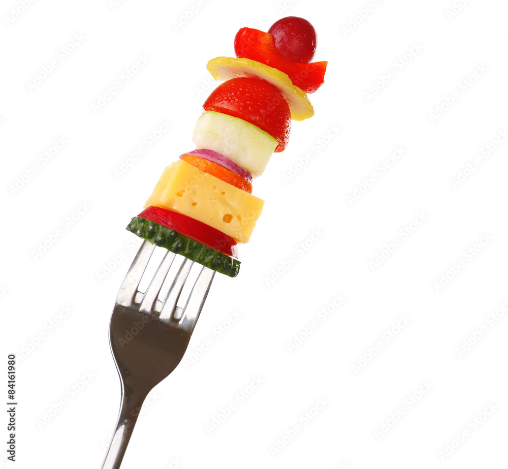 Snack of vegetables on fork isolated on white