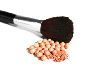 Cosmetic powder balls and makeup brush, isolated on white