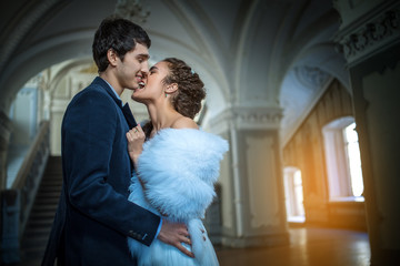 Wall Mural - Portrait of happy wedding couple in classic interior