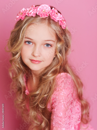 Cute kid girl 10 years old posing over pink Stock Photo | Adobe Stock
