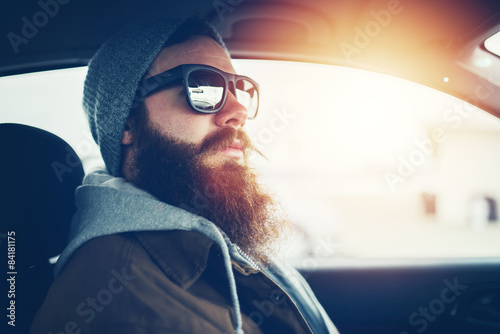 Fotografie, Obraz bearded hipster wearing sunglasses inside car