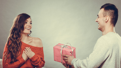 happy romantic couple with gift