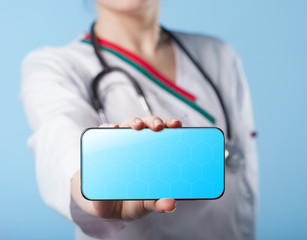 Woman doctor holding a smartphone. Business, technology, interne