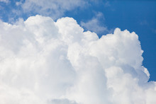 Close Up Of White Fluffy Cumulus Cloud In The Blue Sky
