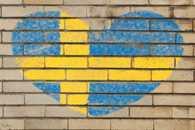 Heart Shape Flag Of Sweden On Brick Wall