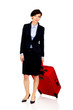 © Piotr Marcinski - Happy businesswoman with suitcase.