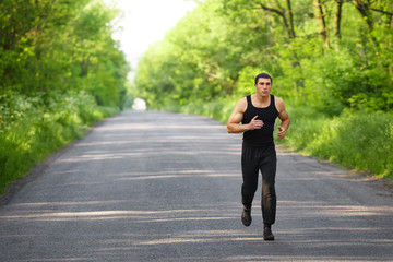  Runner man running on road training sprint. Sporting male run