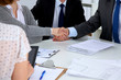 © lenetsnikolai - Business people shaking hands, finishing up a meeting