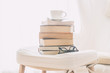 Coffee cup with book and eyeglasses