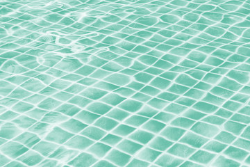 Wall Mural - Light green jade swimming pool water texture reflection.