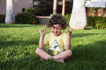 Smiling boy on the grass