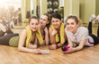 © Prostock-studio - Group of girls in fitness class at the break