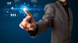 © ra2 studio - Handsome businessman touching future web technology buttons and