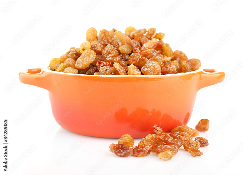 Raisins in pan isolated on white