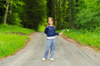 © annanahabed - Cute little girl picking wildflowers in forest