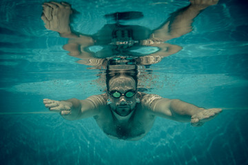 Poster - Underwater portrait of young man