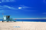 Fototapeta  - Lifeguard station with american flag on Hermosa beach, Californi